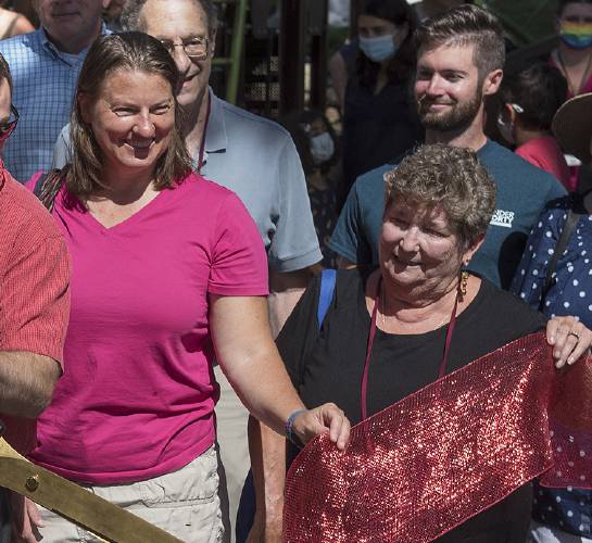Amherst Town Council members Mandi Jo Hanneke, left, and Lynn Griesemertown take part in a ribbon-cutting for the Kendrick Park playground on Aug. 24, 2021.