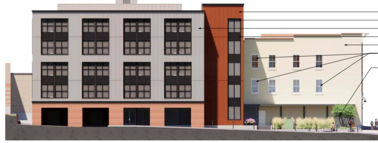 This rendering depicts the new five-story mixed-use building attached to the back of the former Hastings shop at 45 South Pleasant St.; below, the new building is seen from the street, behind the Hastings building. 