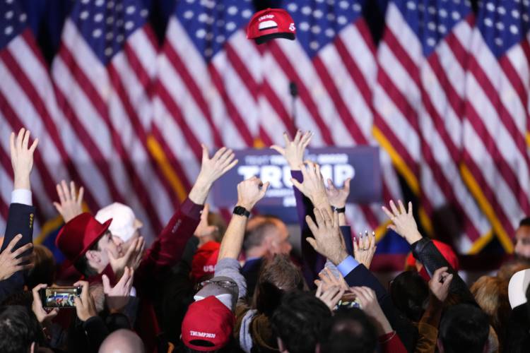 Supporters cheer after learning that Republican presidential candidate former President Donald Trump has won the New Hampshire primary, at a primary election night party in Nashua, N.H., Tuesday, Jan. 23, 2024.