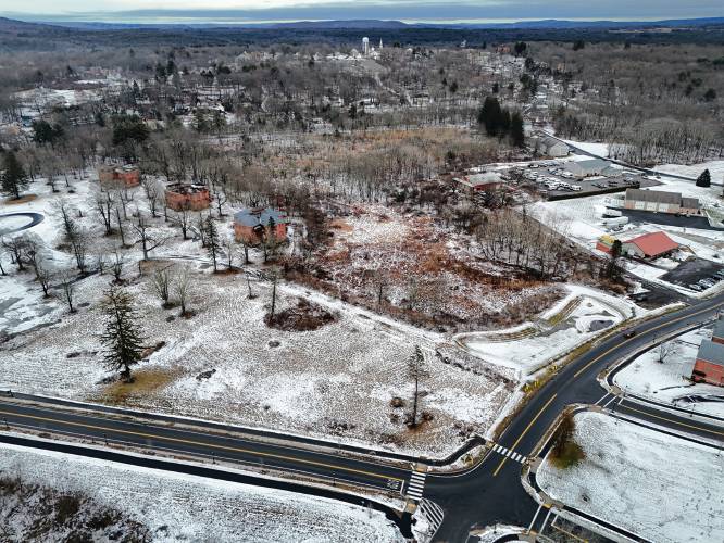 The proposed site of a 108-unit residential development at the old Belchertown State School, at the intersection of Carriage Road to the left and Front Street looking north toward the Town Common.