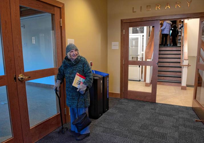 Molly Turner looks over the community room  during the reopening of the North Amherst Library on Monday.  